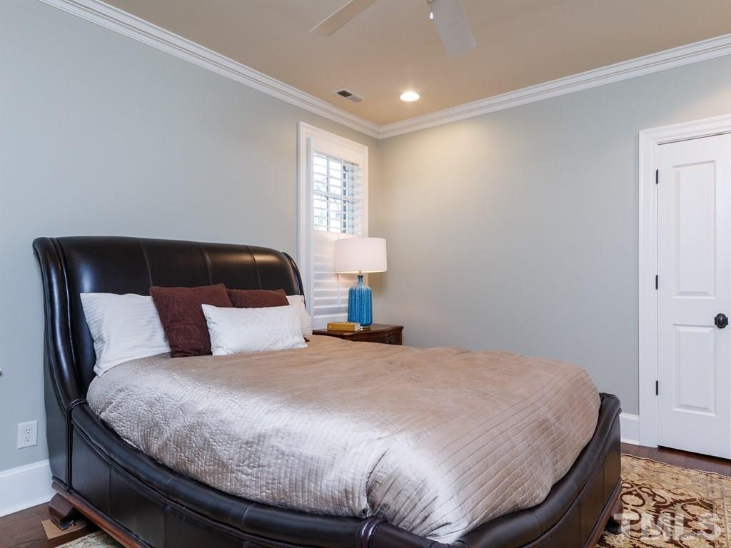 2305 Beechridge Road Raleigh, NC 27608 - Photo 20 of 24 a bedroom with a bed and a window