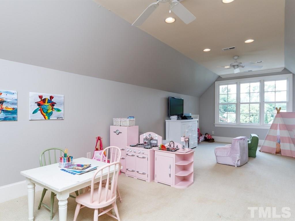 2305 Beechridge Road Raleigh, NC 27608 - Photo 21 of 24 a room with a table and chairs