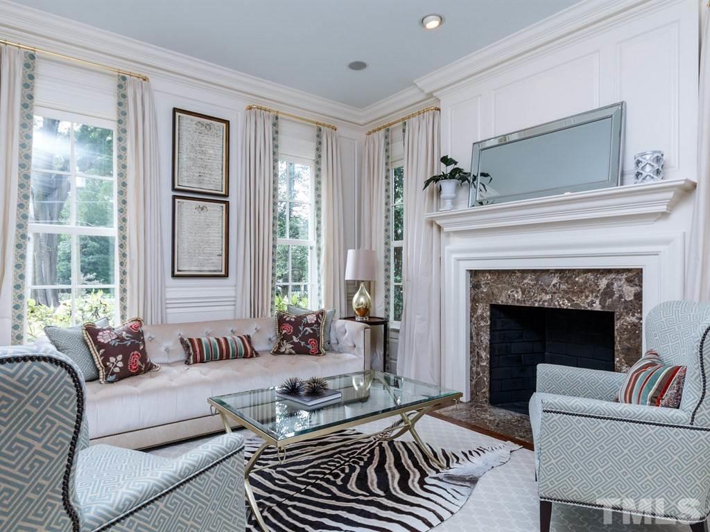 2305 Beechridge Road Raleigh, NC 27608 - Photo 4 of 24 a living room with furniture and a fireplace
