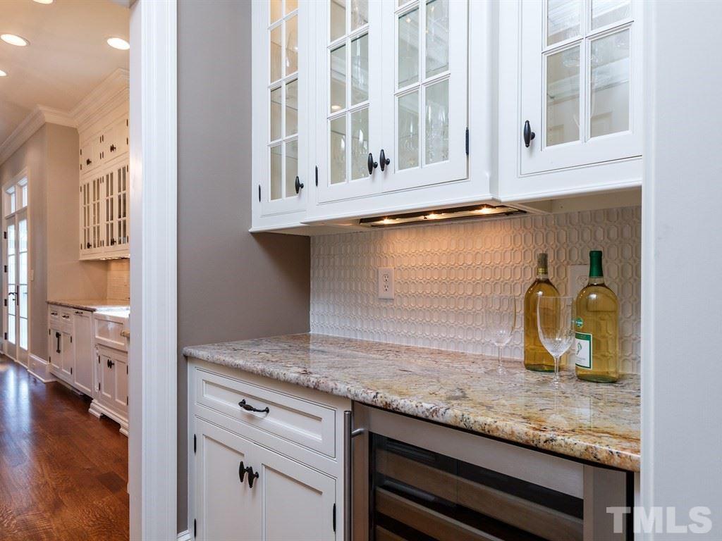 2305 Beechridge Road Raleigh, NC 27608 - Photo 6 of 24 a kitchen with granite countertop a stove and a white cabinets