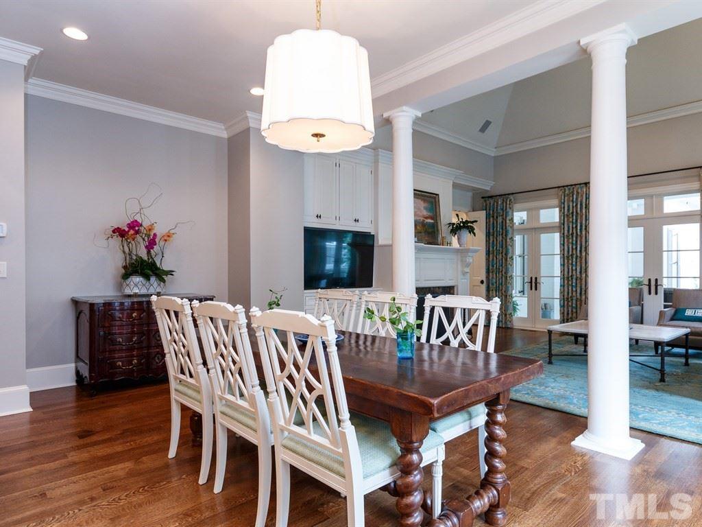 2305 Beechridge Road Raleigh, NC 27608 - Photo 9 of 24 a view of a dining room with furniture and wooden floor