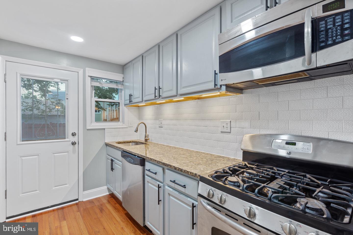 225 14th Place Northeast Washington, DC 20002 - Photo 7 of 20 Modern kitchen with sleek finishes.