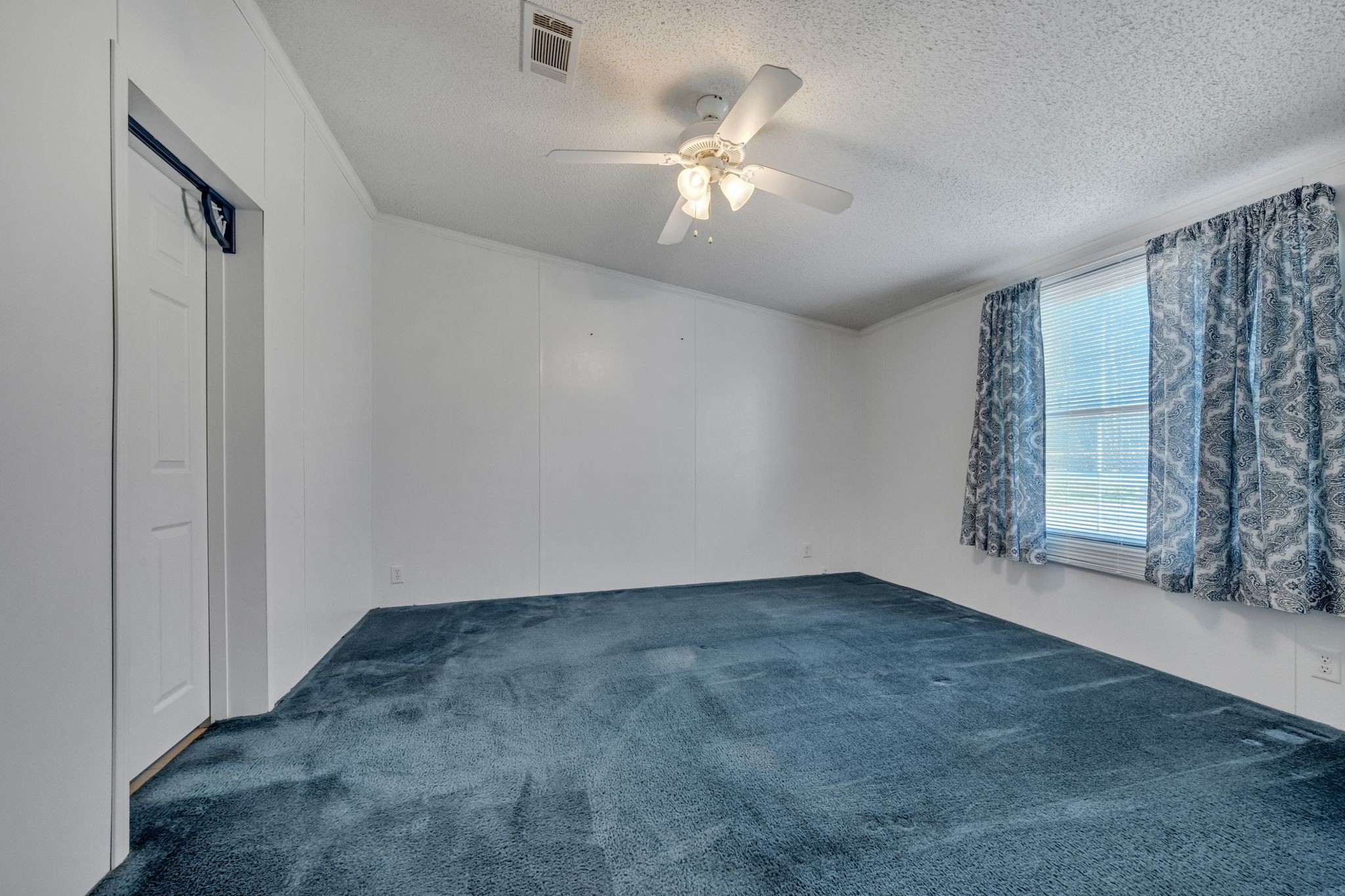 11364 Potts Hollow Road Lyles, TN 37098 - Photo 15 of 29 an empty room with windows and chandelier fan