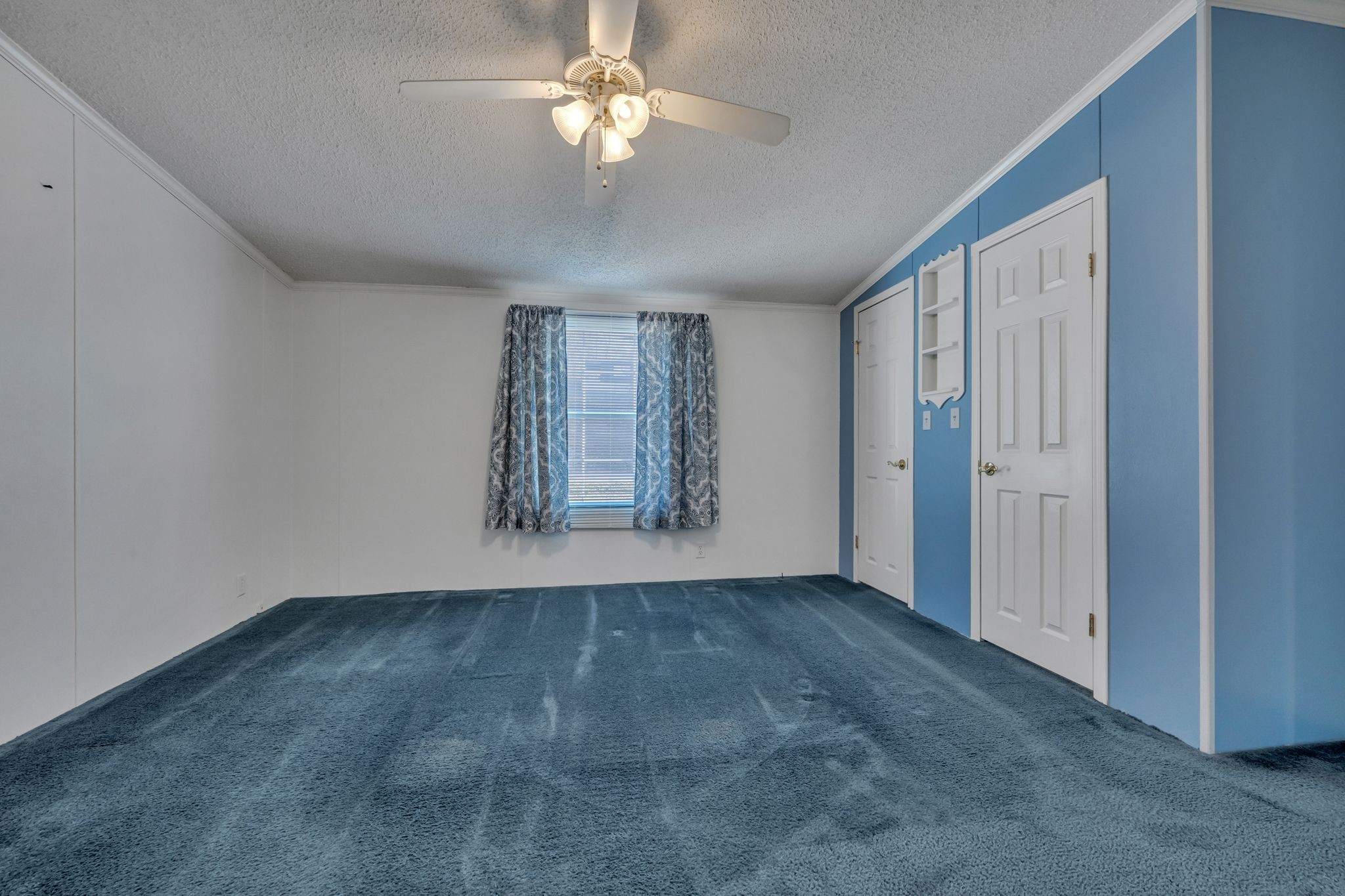 11364 Potts Hollow Road Lyles, TN 37098 - Photo 16 of 29 an empty room with windows and fan