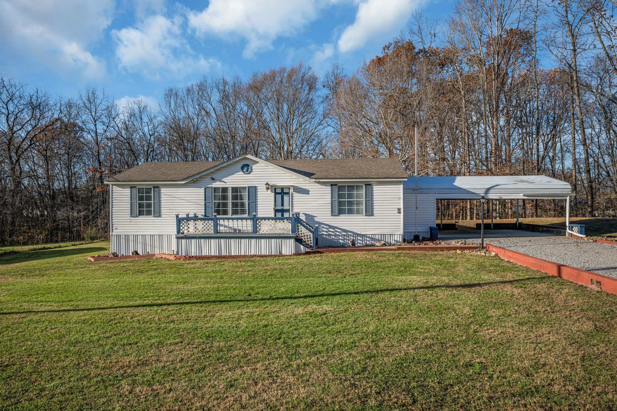 11364 Potts Hollow Road Lyles, TN 37098 - Photo 2 of 29 a front view of a house with a garden