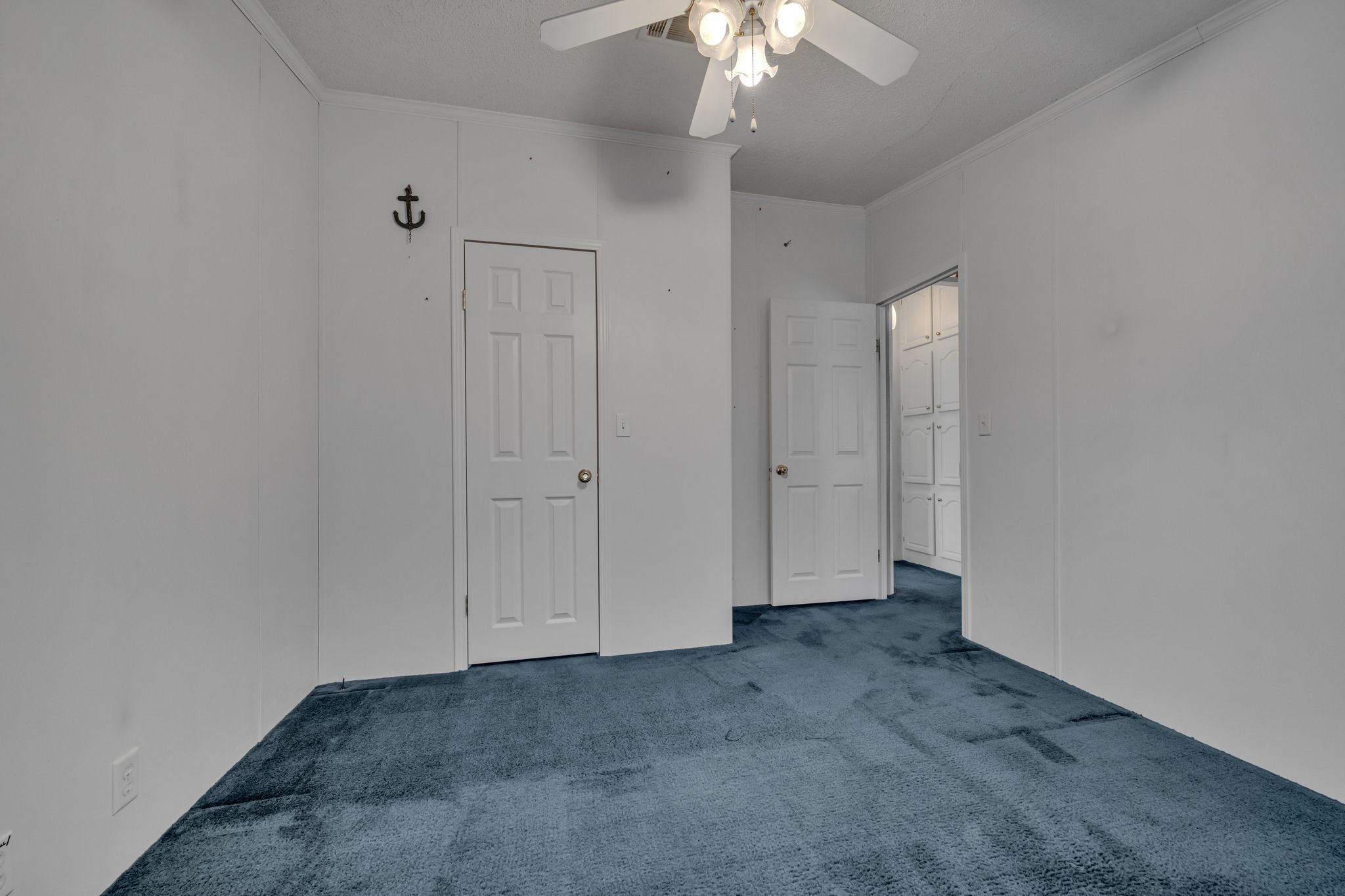 11364 Potts Hollow Road Lyles, TN 37098 - Photo 21 of 29 an empty room with a chandelier fan