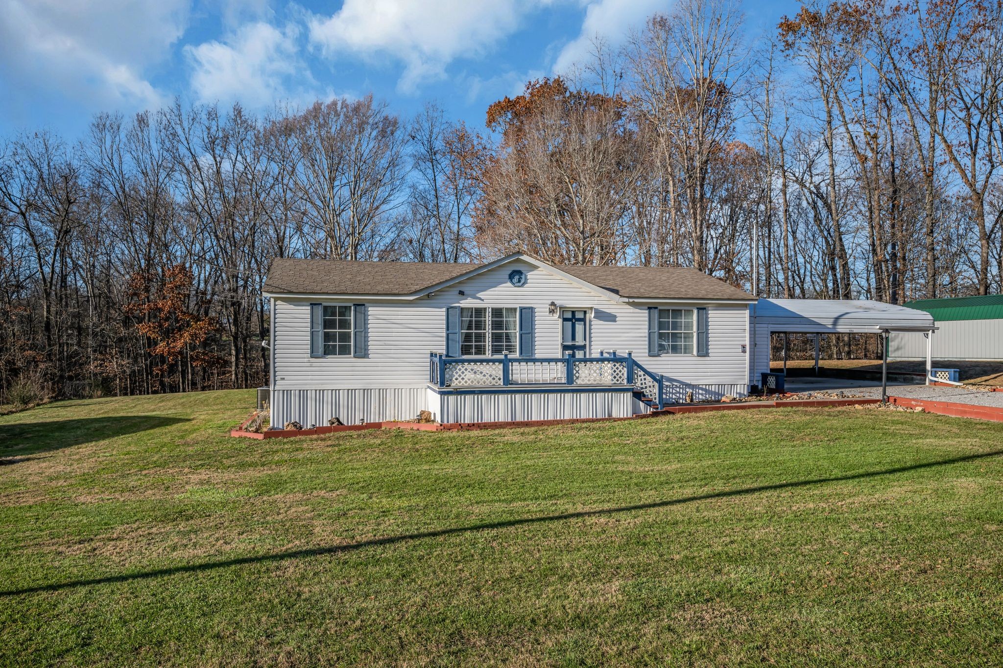 11364 Potts Hollow Road Lyles, TN 37098 - Photo 3 of 29 a front view of a house with a garden