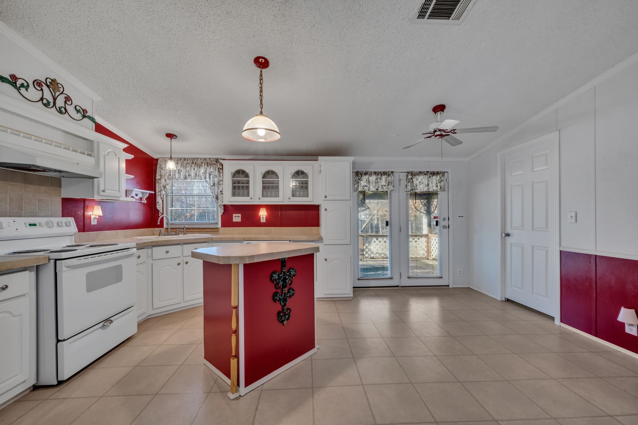 11364 Potts Hollow Road Lyles, TN 37098 - Photo 9 of 29 a kitchen with granite countertop a stove and cabinets