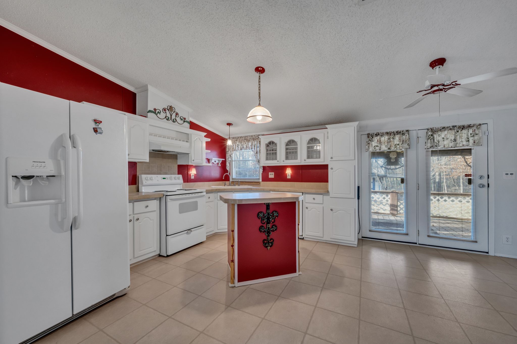11364 Potts Hollow Road Lyles, TN 37098 - Photo 10 of 29 a kitchen with refrigerator and cabinets