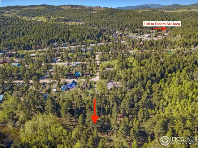 a view of a town with mountains in the background