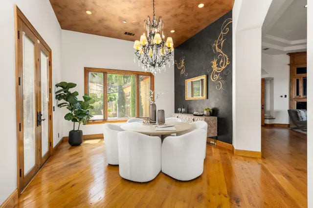 a large kitchen with a table and chairs