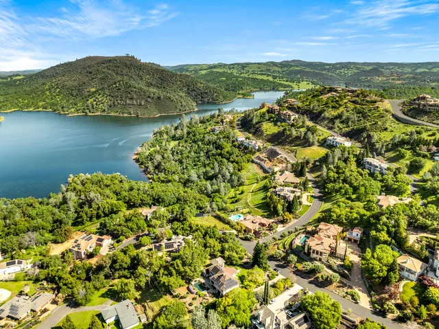 front view of a brick house with a yard