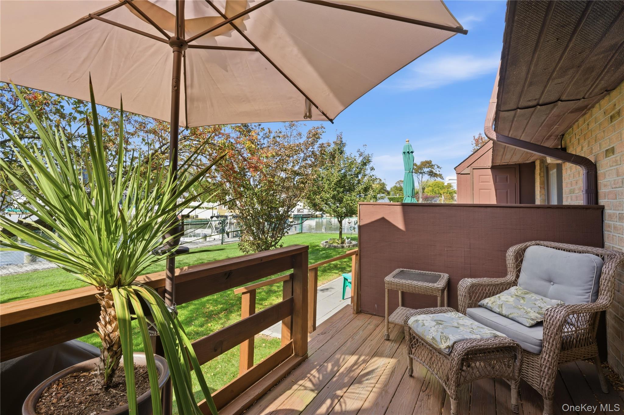 313 Mariners Way Copiague, NY 11726 - Photo 19 of 25 a balcony with table and chairs