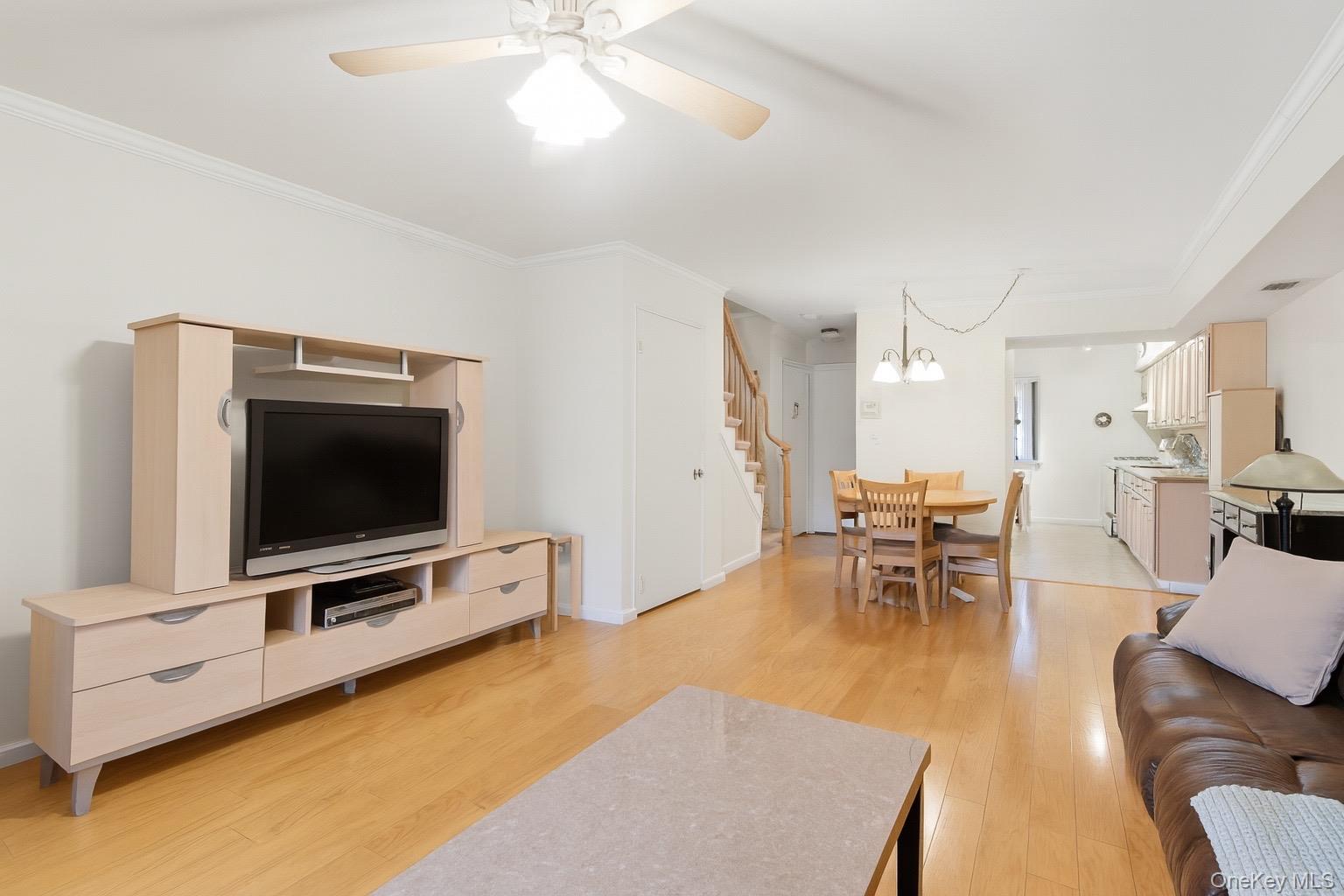 313 Mariners Way Copiague, NY 11726 - Photo 7 of 25 a living room with furniture and a flat screen tv