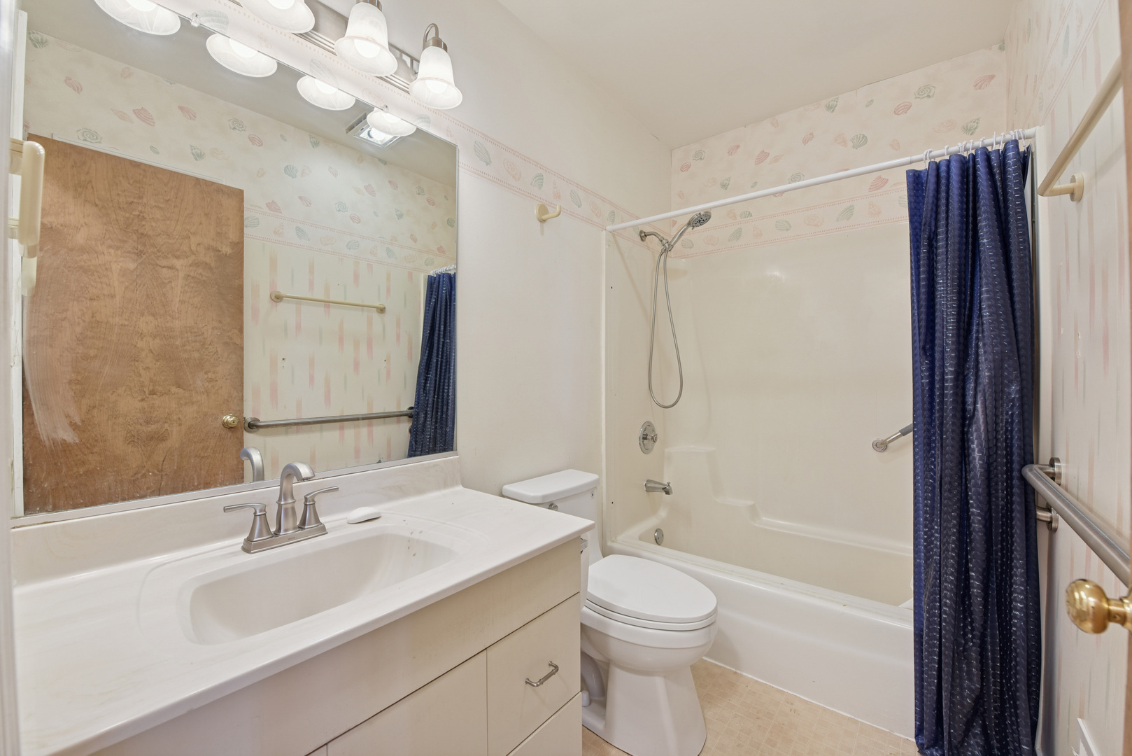 240 North Willow Road Elmhurst, IL 60126 - Photo 15 of 45 a bathroom with a sink a toilet and shower