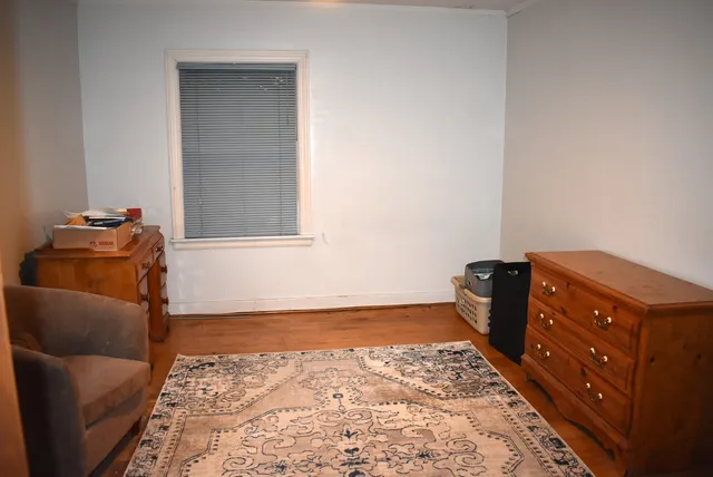 a living room with a bed and a couch