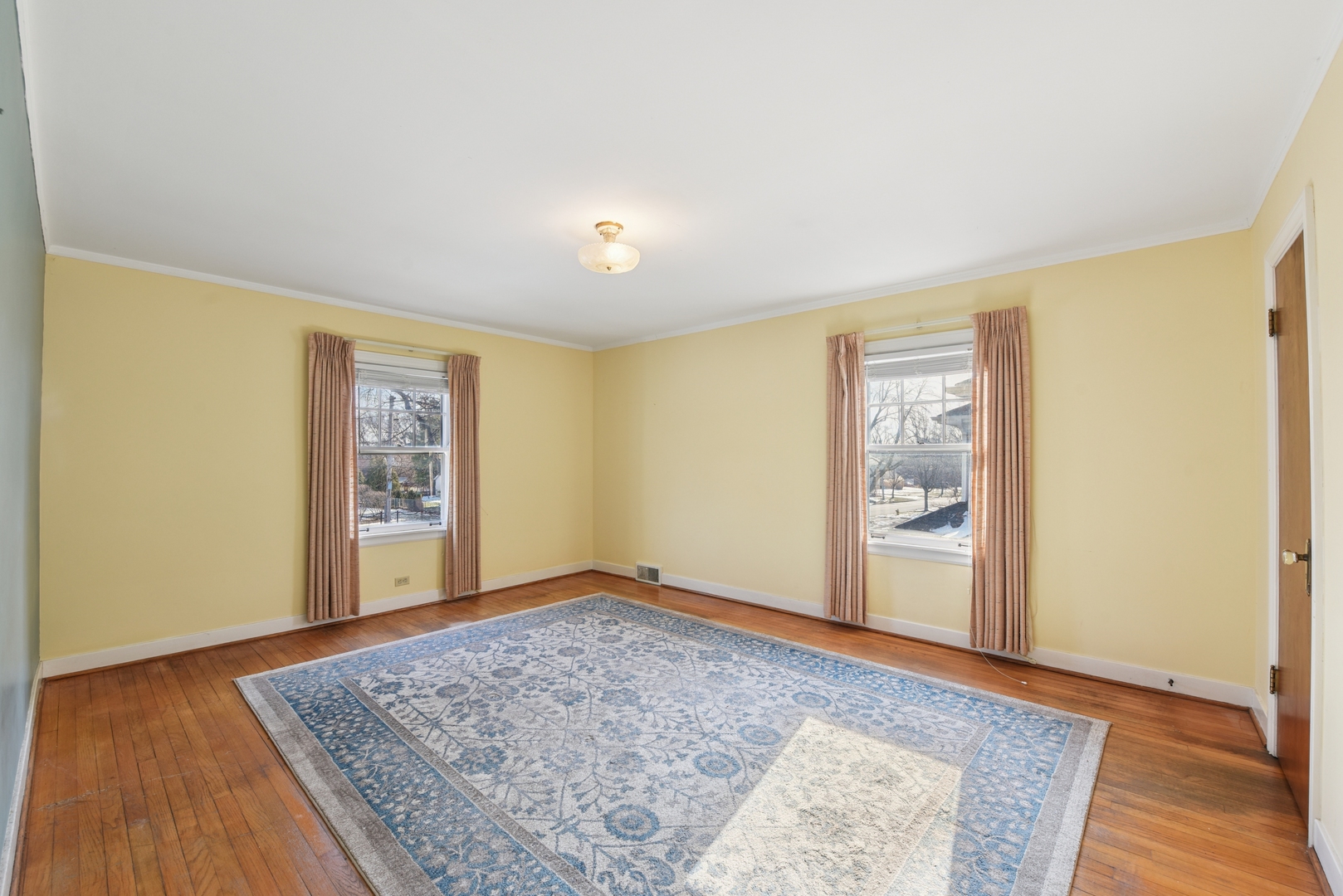 240 North Willow Road Elmhurst, IL 60126 - Photo 22 of 45 a view of an empty room with wooden floor and a window