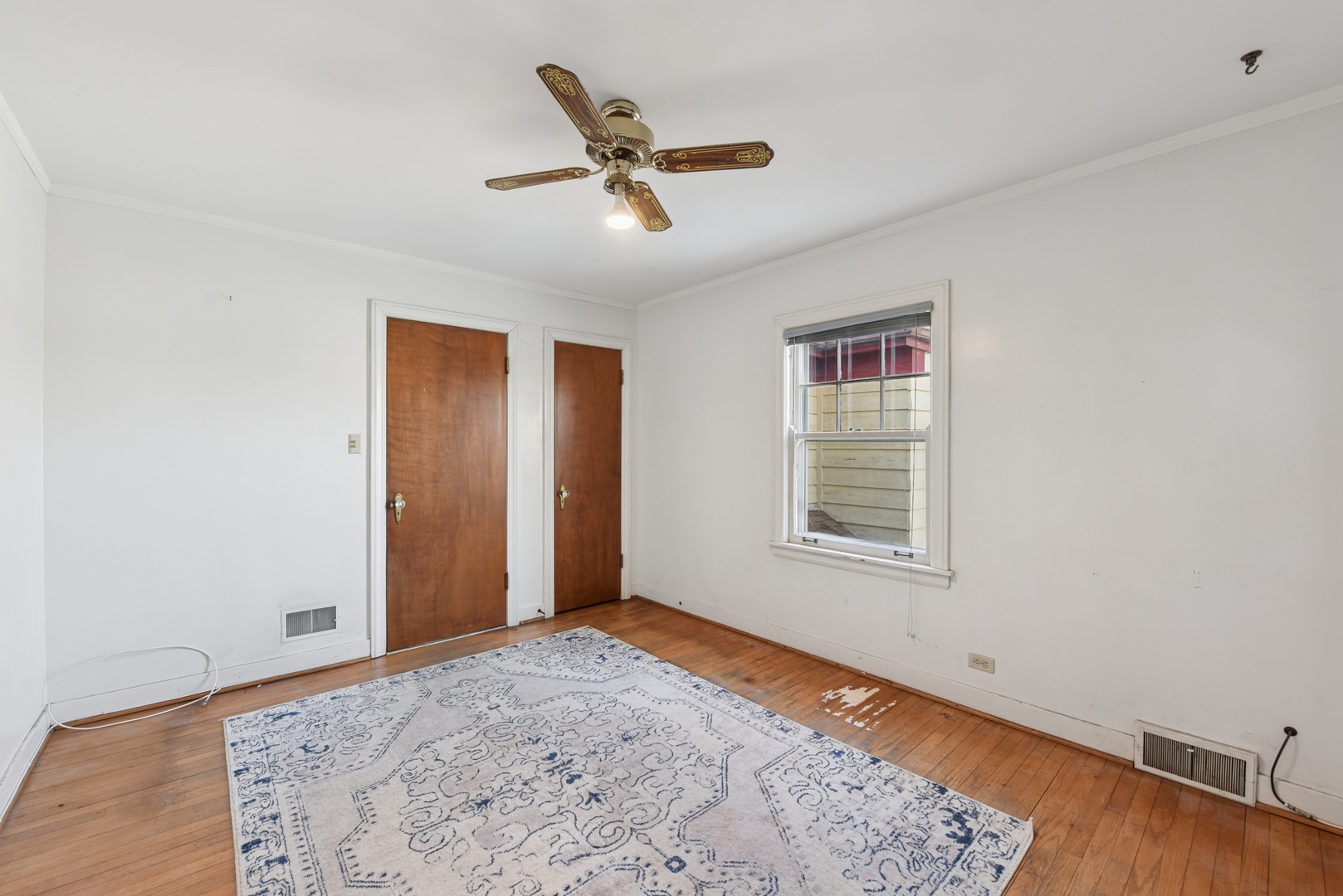 240 North Willow Road Elmhurst, IL 60126 - Photo 27 of 45 a view of a livingroom with a ceiling fan and wooden floor