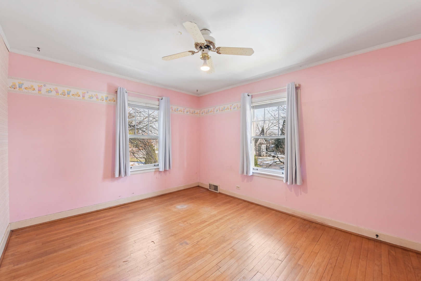 240 North Willow Road Elmhurst, IL 60126 - Photo 29 of 45 a view of an empty room with a window and wooden floor