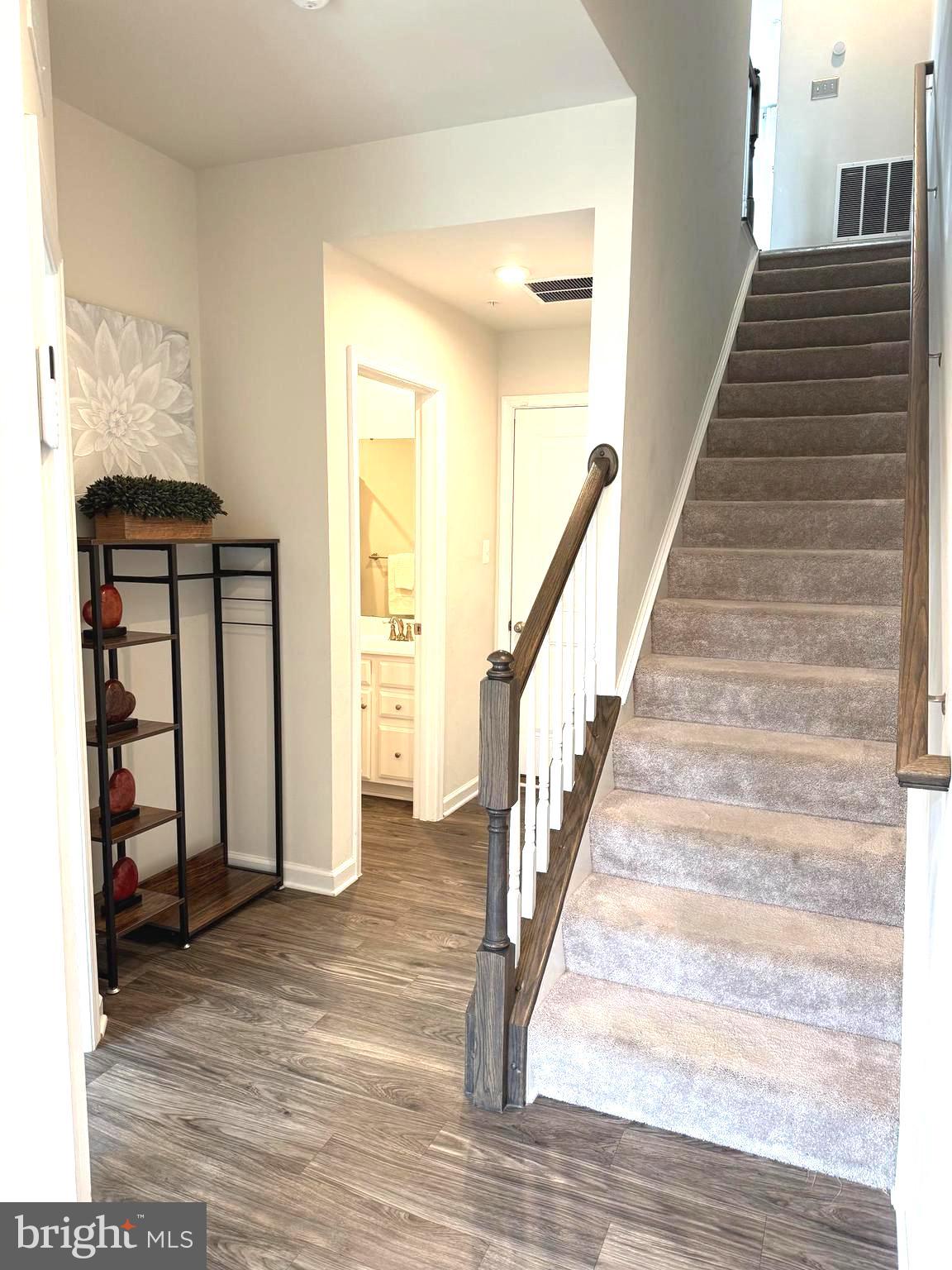 3111 Potters Hill Road Hanover, MD 21076 - Photo 25 of 40 a view of a hallway with wooden floor and staircase