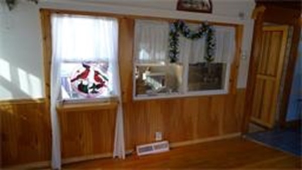 93 Better Way Springfield, MA 01119 - Photo 8 of 25 a view of a hallway with wooden floor and front door
