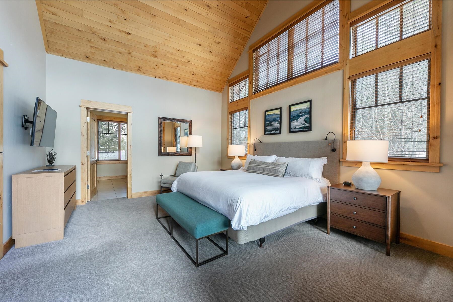 12428 Trappers Trail, Unit F3107 Truckee, CA 96161 - Photo 18 of 28 a spacious bedroom with a bed and cabinets