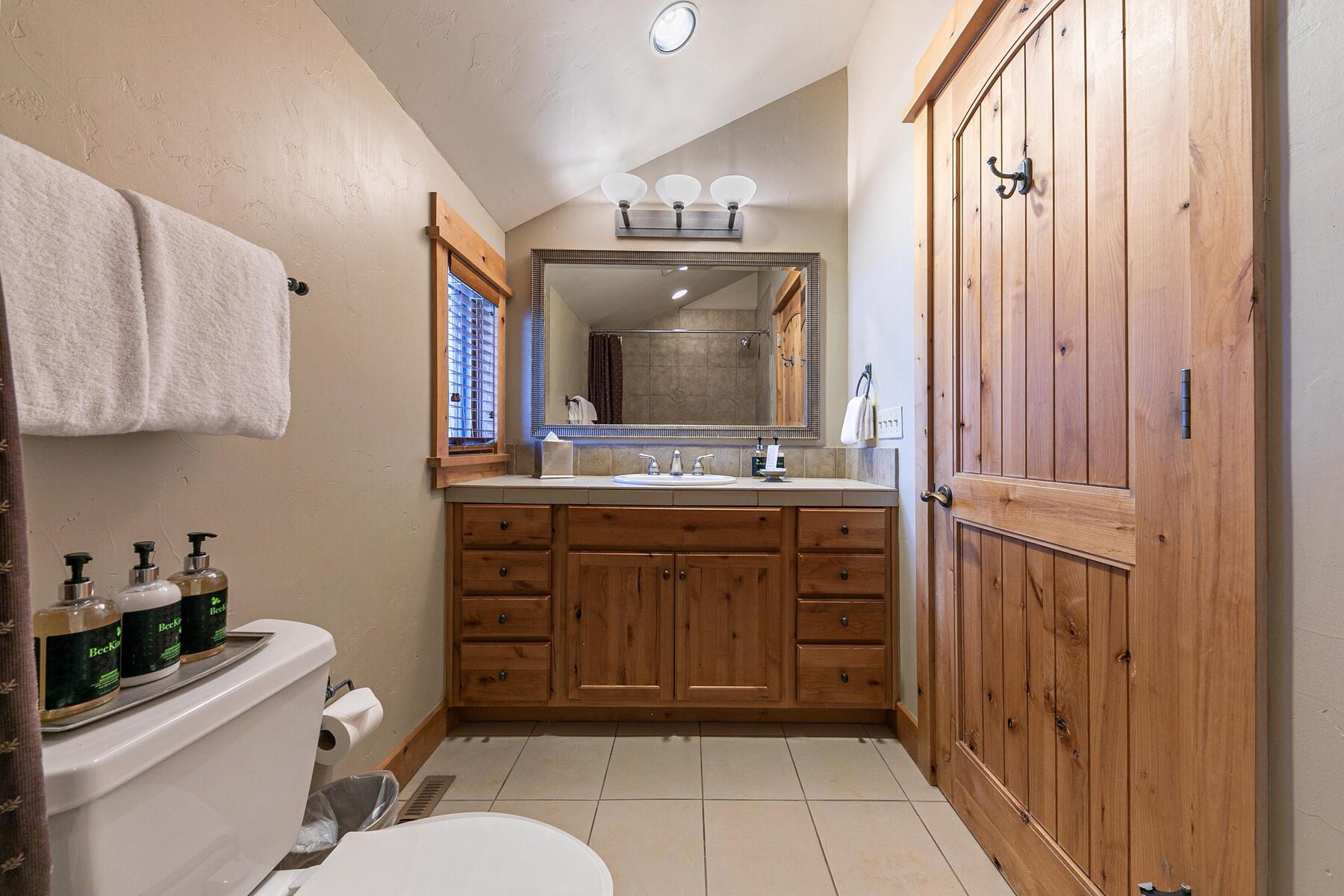 12428 Trappers Trail, Unit F3107 Truckee, CA 96161 - Photo 20 of 28 a bathroom with a sink a toilet and vanity