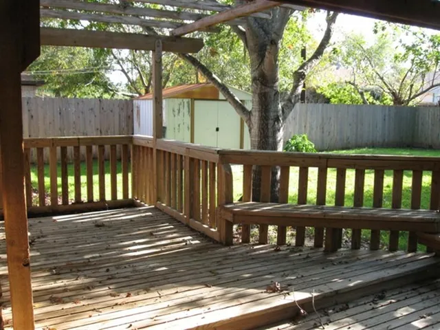 a view of a wooden roof deck