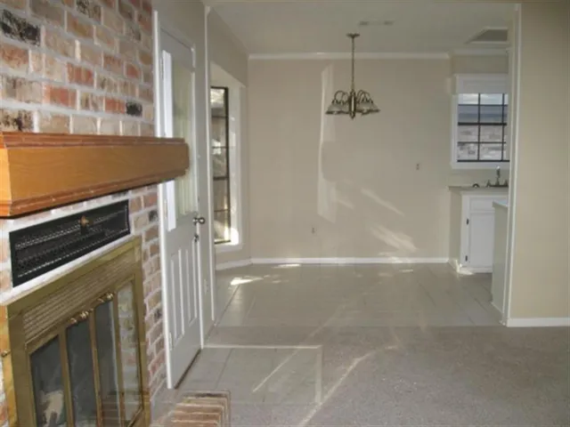a bathroom with a granite countertop sink a mirror and shower
