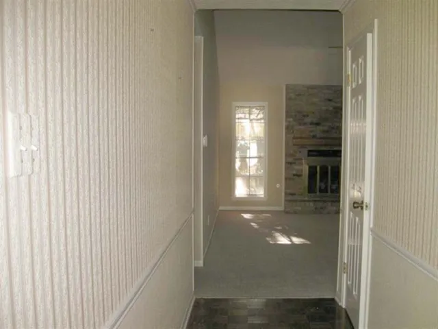 a view of a hallway with windows