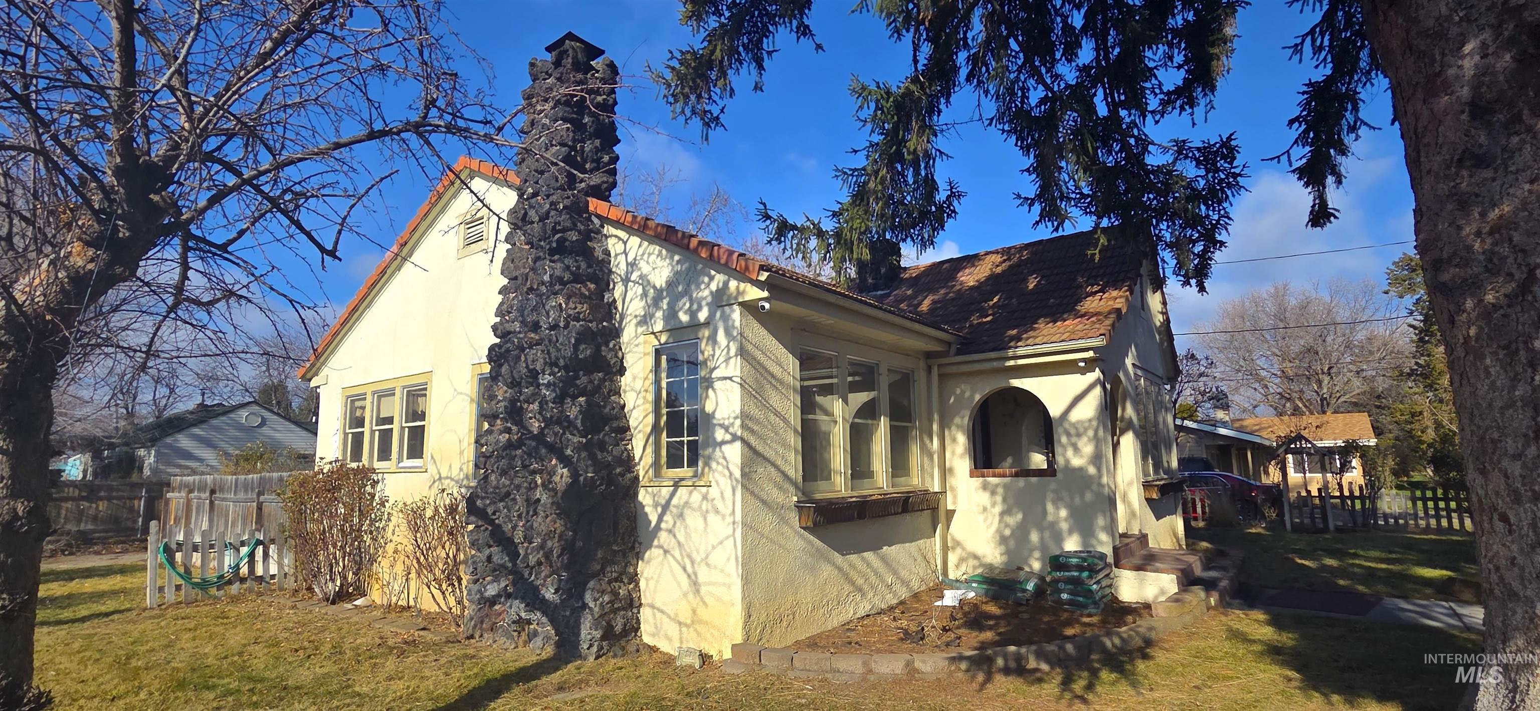2305 South Gekeler Lane Boise, ID 83706 - Photo 2 of 33 View of home's exterior with stucco siding and a chimney