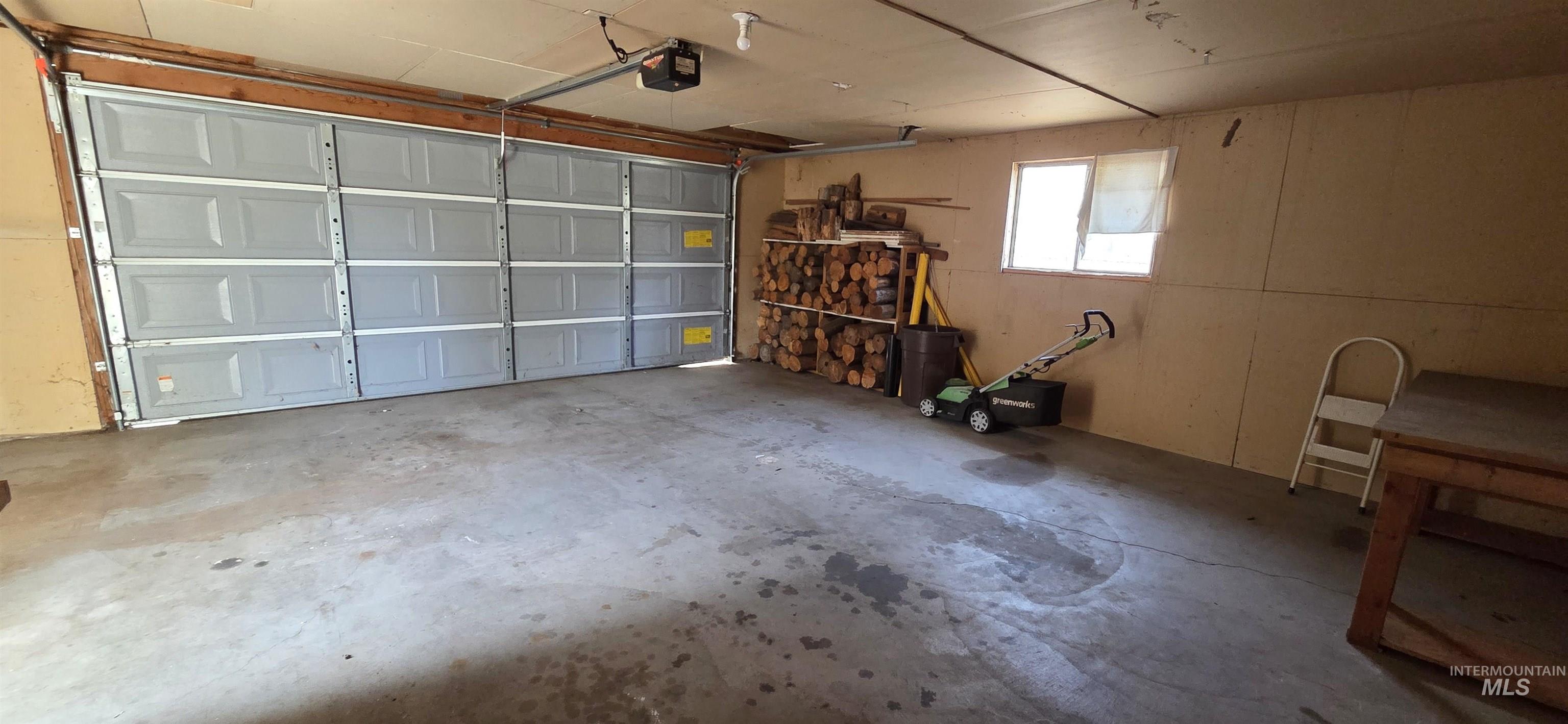 2305 South Gekeler Lane Boise, ID 83706 - Photo 25 of 33 Garage featuring a garage door opener