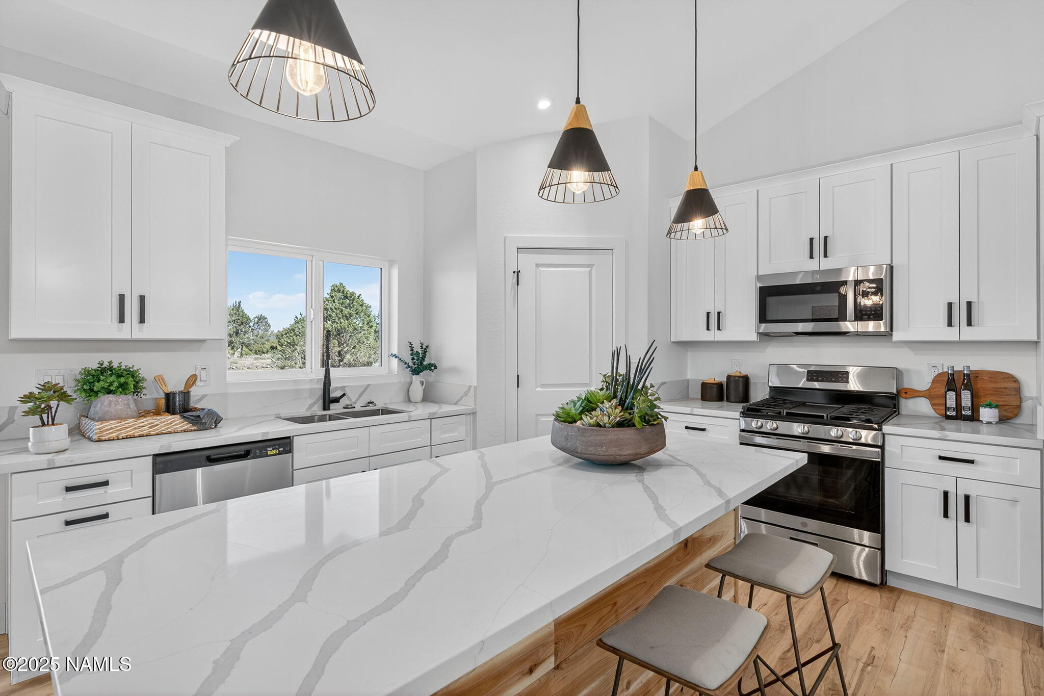 7943 North Red Lake Road Williams, AZ 86046 - Photo 13 of 33 a kitchen with sink cabinets and window