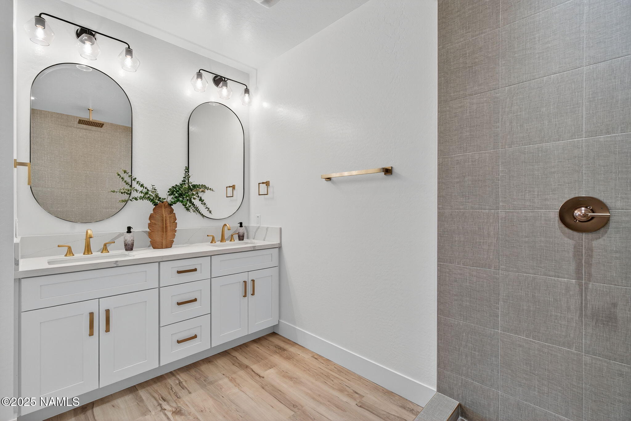 7943 North Red Lake Road Williams, AZ 86046 - Photo 16 of 33 a bathroom with a double vanity sink and a mirror