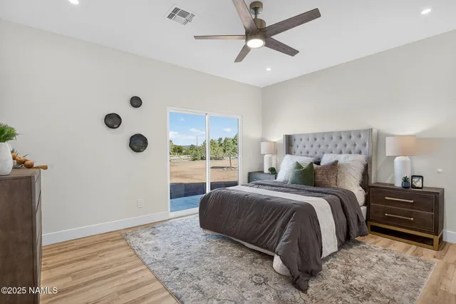 a spacious bedroom with a bed and a window