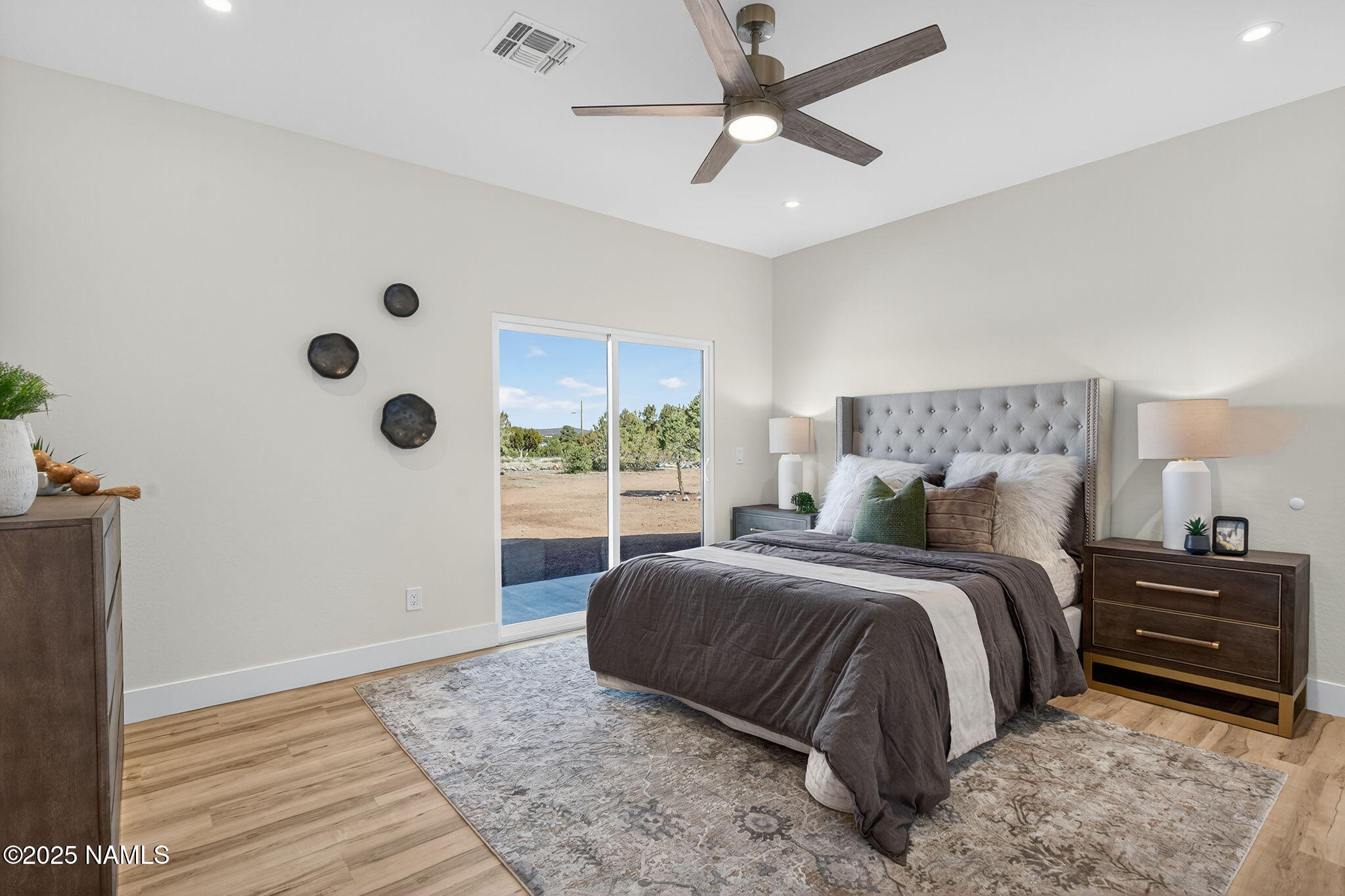 7943 North Red Lake Road Williams, AZ 86046 - Photo 17 of 33 a spacious bedroom with a bed and a window
