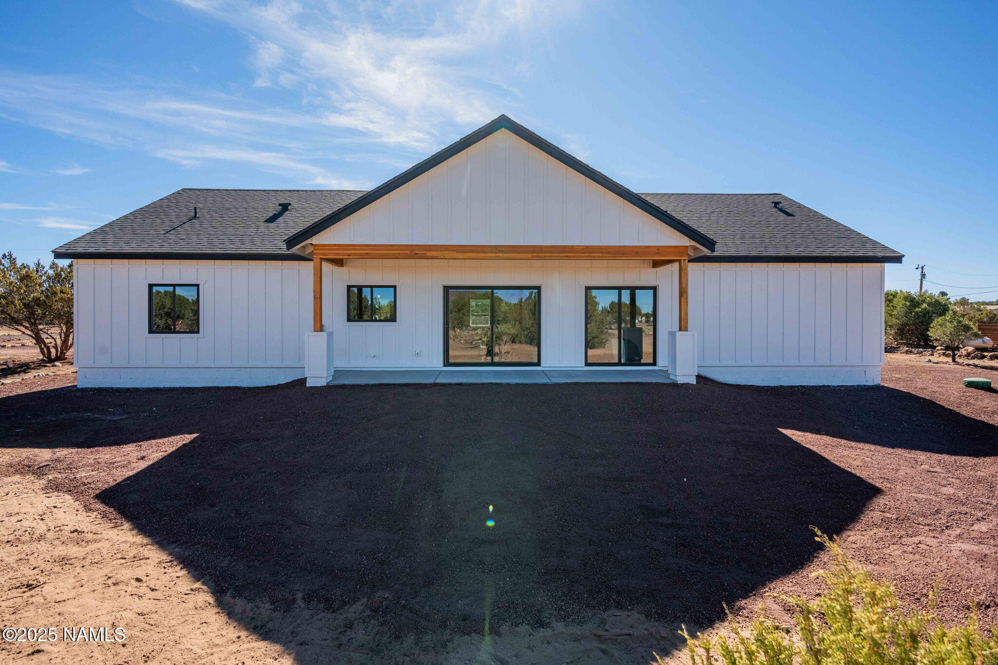 7943 North Red Lake Road Williams, AZ 86046 - Photo 2 of 33 a front view of a house with a yard
