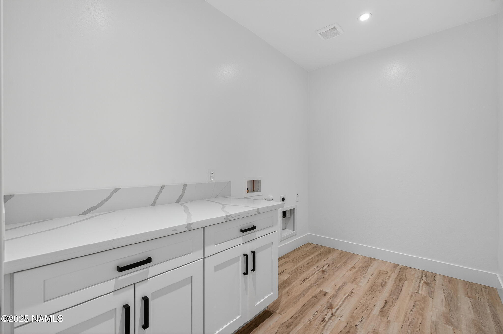 7943 North Red Lake Road Williams, AZ 86046 - Photo 23 of 33 a view of cabinets with wooden floor