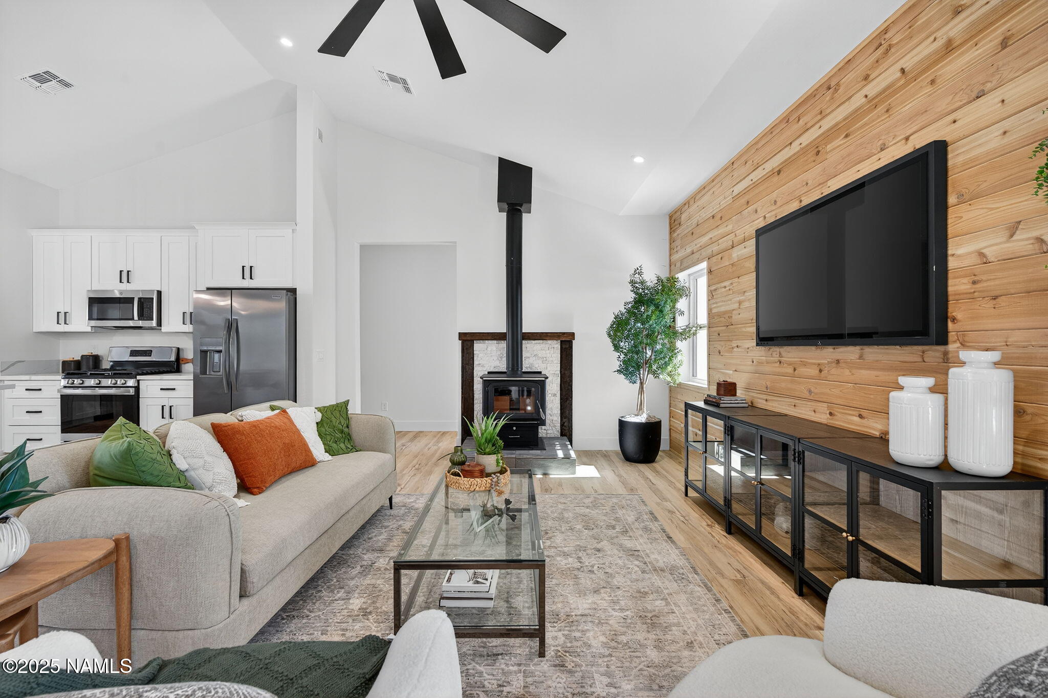 7943 North Red Lake Road Williams, AZ 86046 - Photo 6 of 33 a living room with furniture and a flat screen tv