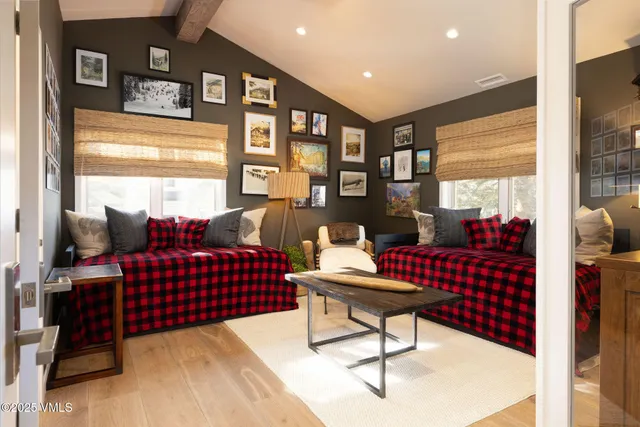 a living room with furniture and a floor to ceiling window