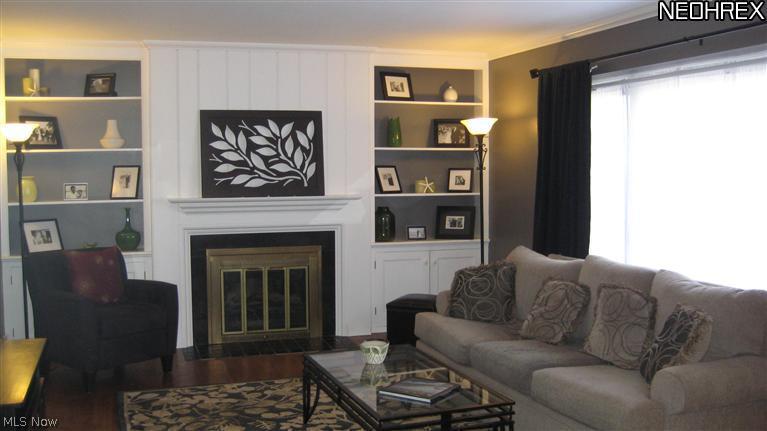 4154 Silsby Road University Heights, OH 44118 - Photo 2 of 18 The living room has has a fireplace with floor to ceiling built-ins on either side.