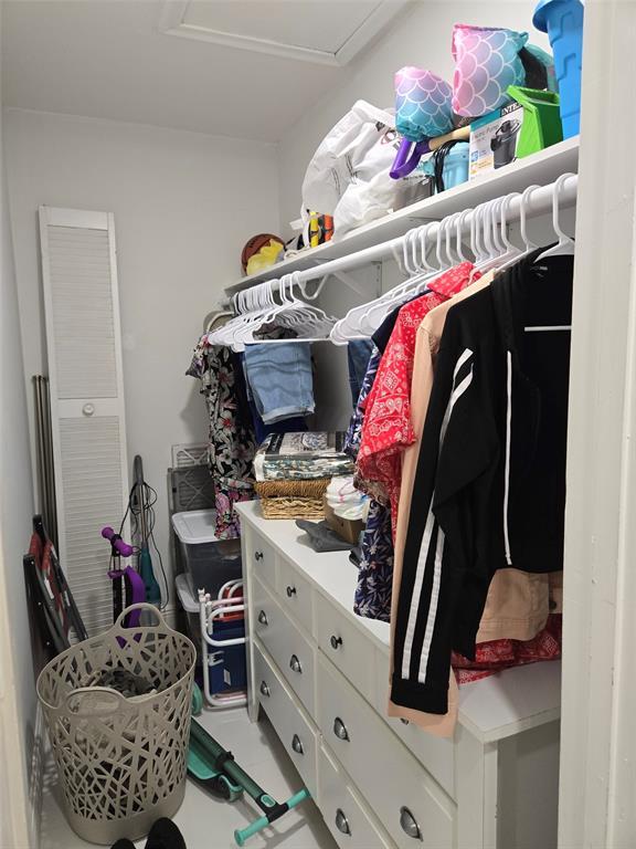 229 Durham East, Unit 229 Deerfield Beach, FL 33442 - Photo 13 of 64 a bedroom with a bed and cabinets