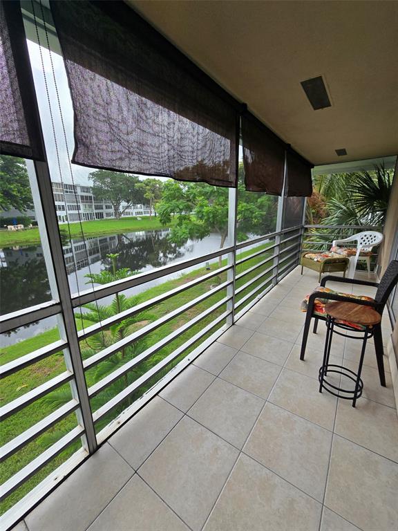 229 Durham East, Unit 229 Deerfield Beach, FL 33442 - Photo 16 of 64 a view of a two chair in the balcony
