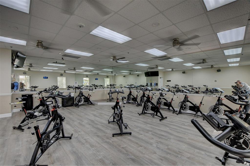 229 Durham East, Unit 229 Deerfield Beach, FL 33442 - Photo 20 of 64 a view of a room with gym equipment