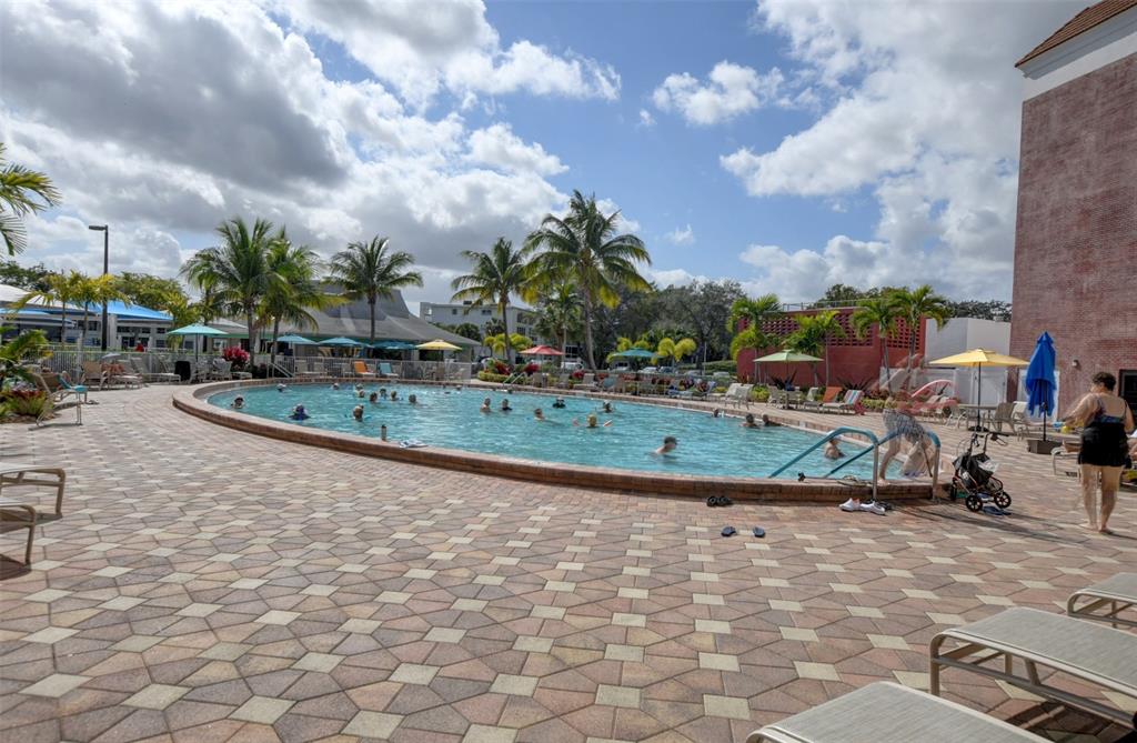 229 Durham East, Unit 229 Deerfield Beach, FL 33442 - Photo 27 of 64 a view of outdoor space playground and lake view