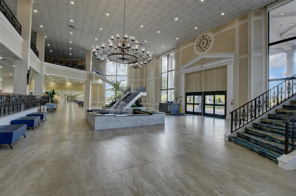 229 Durham East, Unit 229 Deerfield Beach, FL 33442 - Photo 38 of 64 a view of a room with lots of wooden furniture and windows