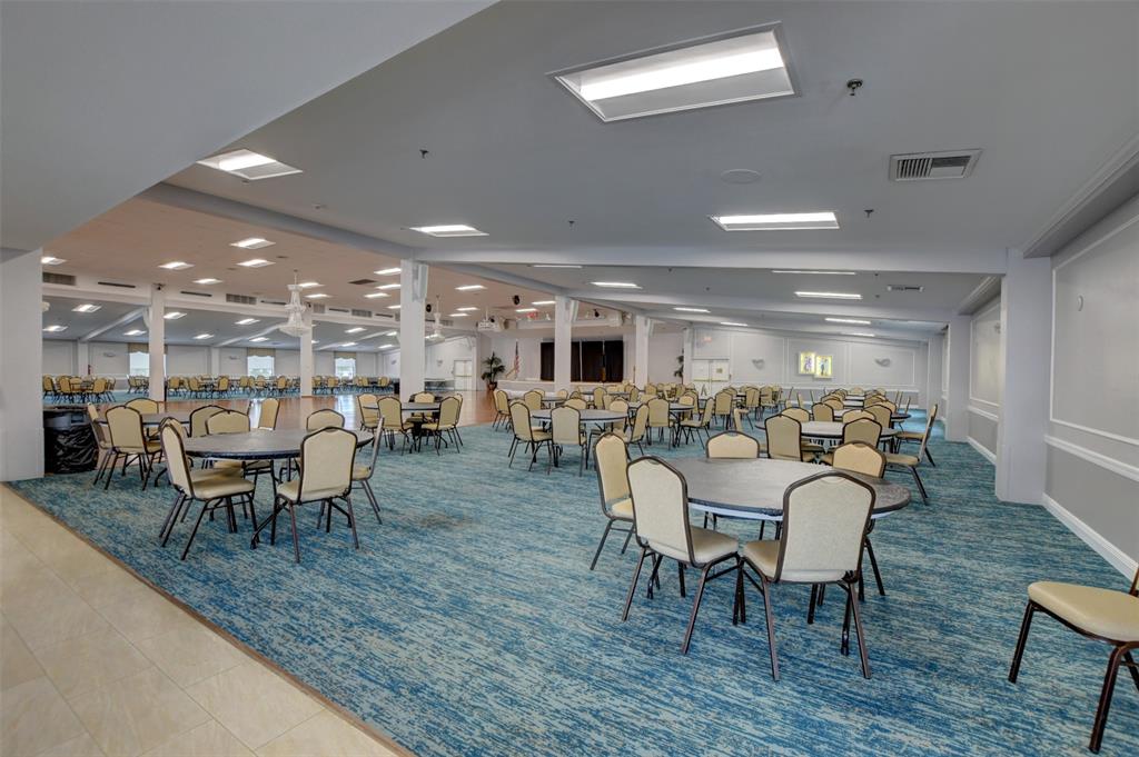 229 Durham East, Unit 229 Deerfield Beach, FL 33442 - Photo 39 of 64 a view of a dining room with furniture