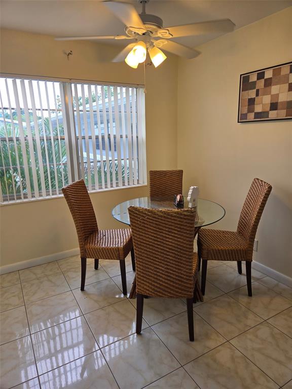 229 Durham East, Unit 229 Deerfield Beach, FL 33442 - Photo 6 of 64 a view of a livingroom with furniture and a window