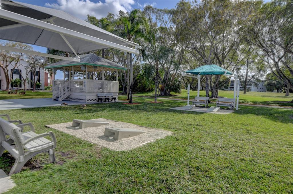 229 Durham East, Unit 229 Deerfield Beach, FL 33442 - Photo 62 of 64 a view of a house with a yard