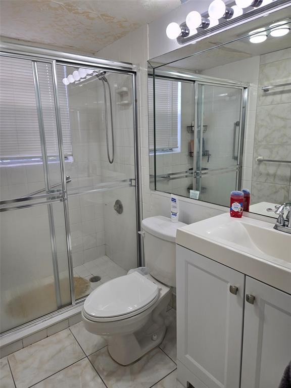 229 Durham East, Unit 229 Deerfield Beach, FL 33442 - Photo 8 of 64 a bathroom with a sink toilet and shower